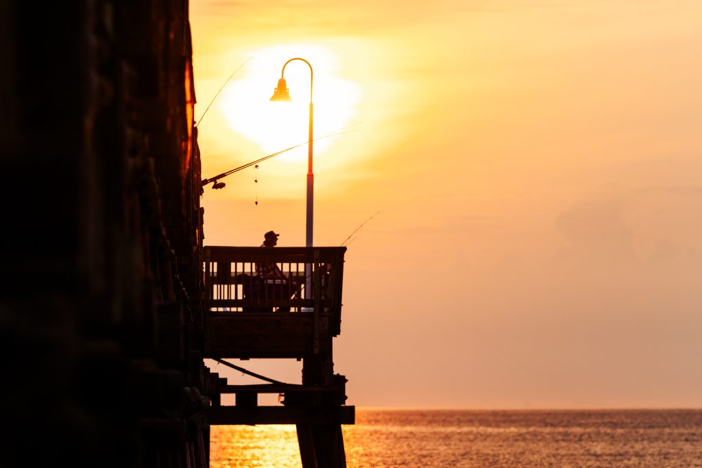 Backlit photo of Virginia Beach fishing pier