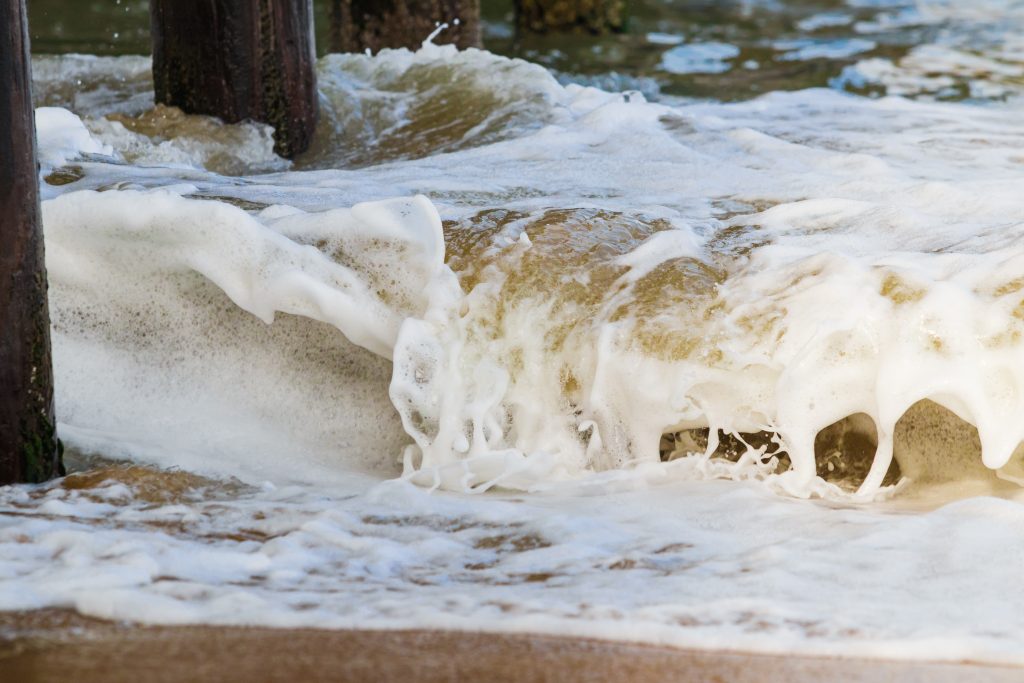 close up of foam on waves
