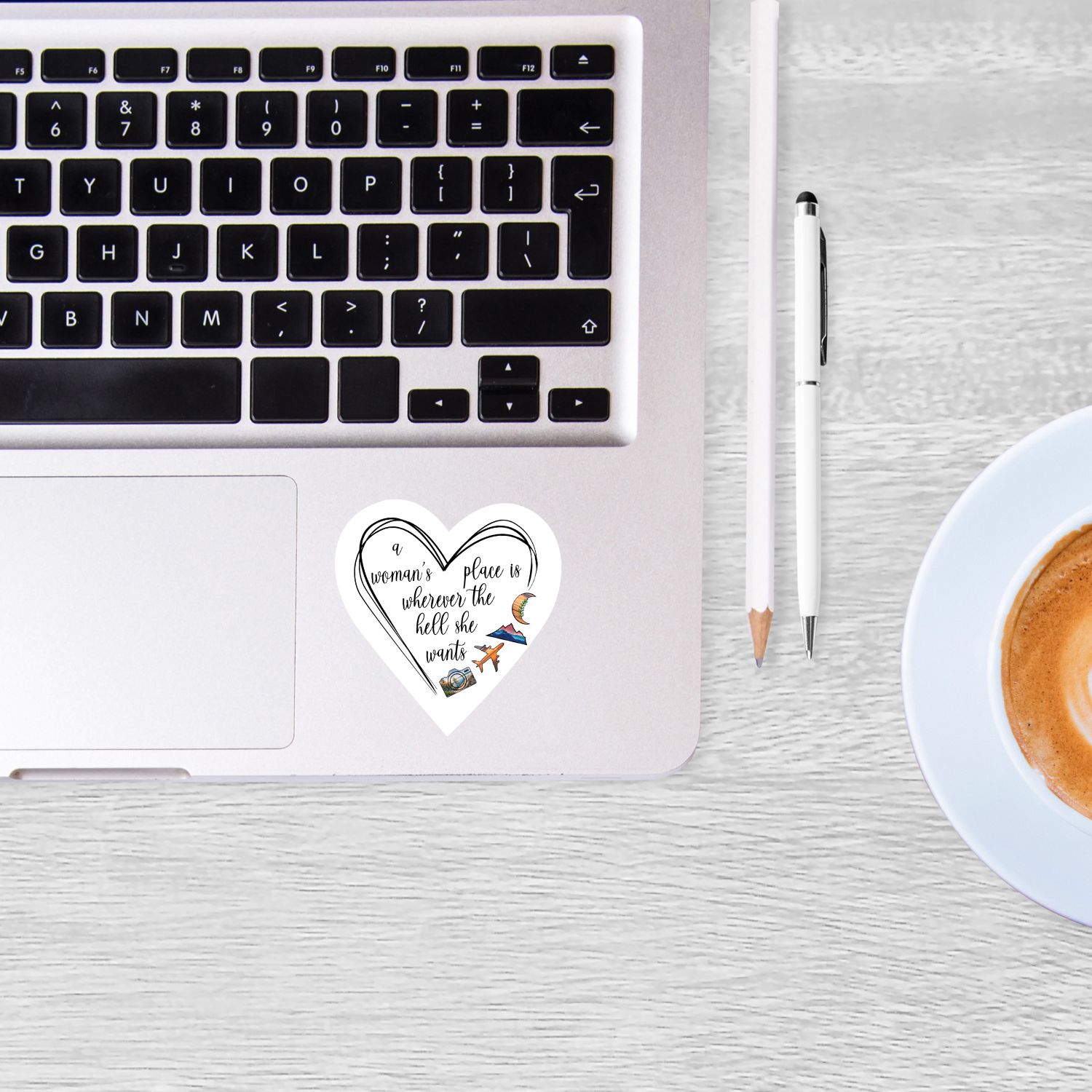 heart shaped feminism sticker on laptop