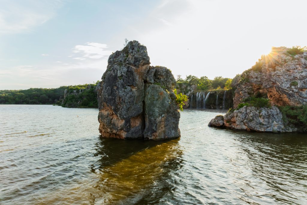 see the waterfall and rock formations on Lake Buchanan with a boat cruise